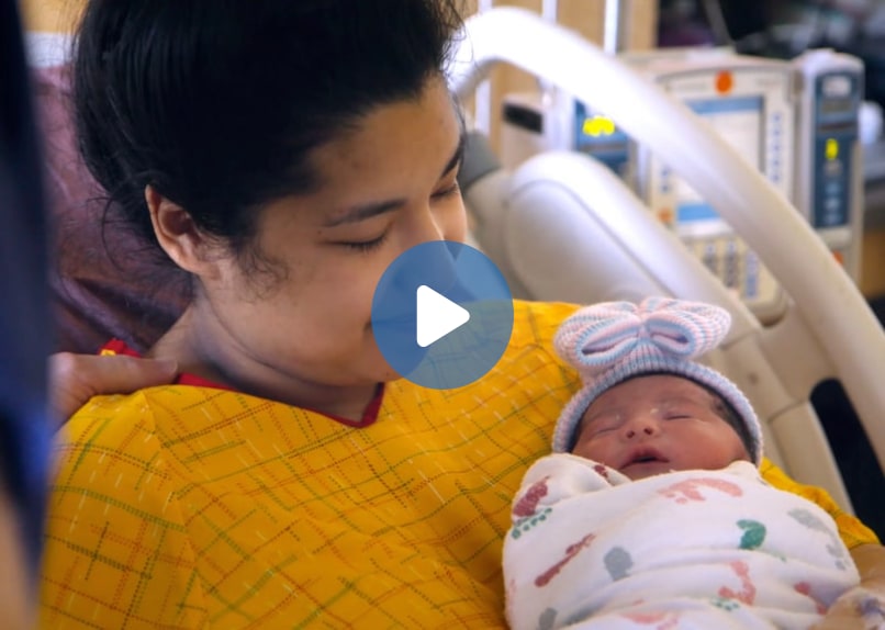 mother holding her newborn baby