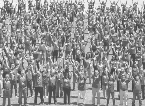crowd of people with arms raised