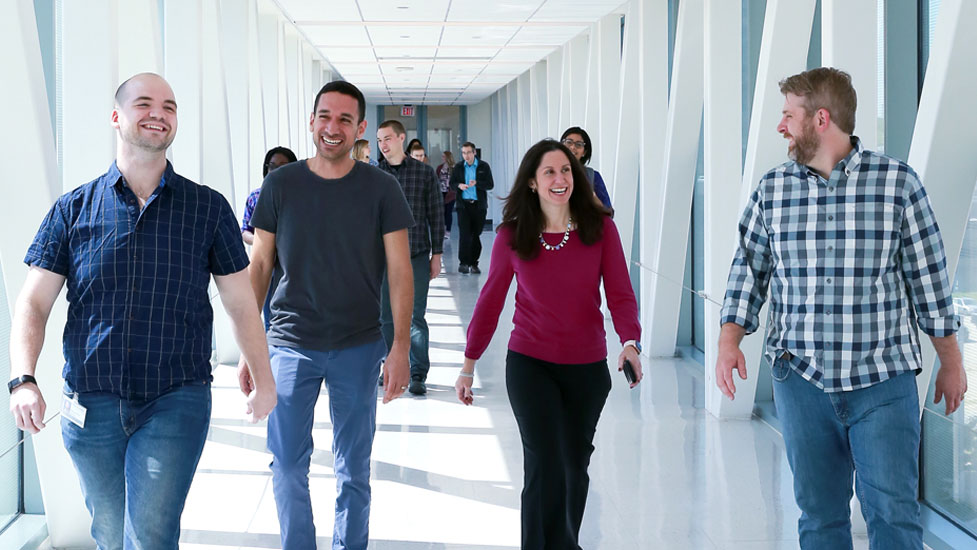 Students walking and laughing in the hallway
