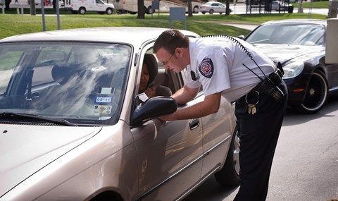 Parking Services officer giving directions to a motorist.