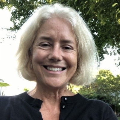 Jody Hoffer Gittell, Ph.D., smiling blond woman in black shirt