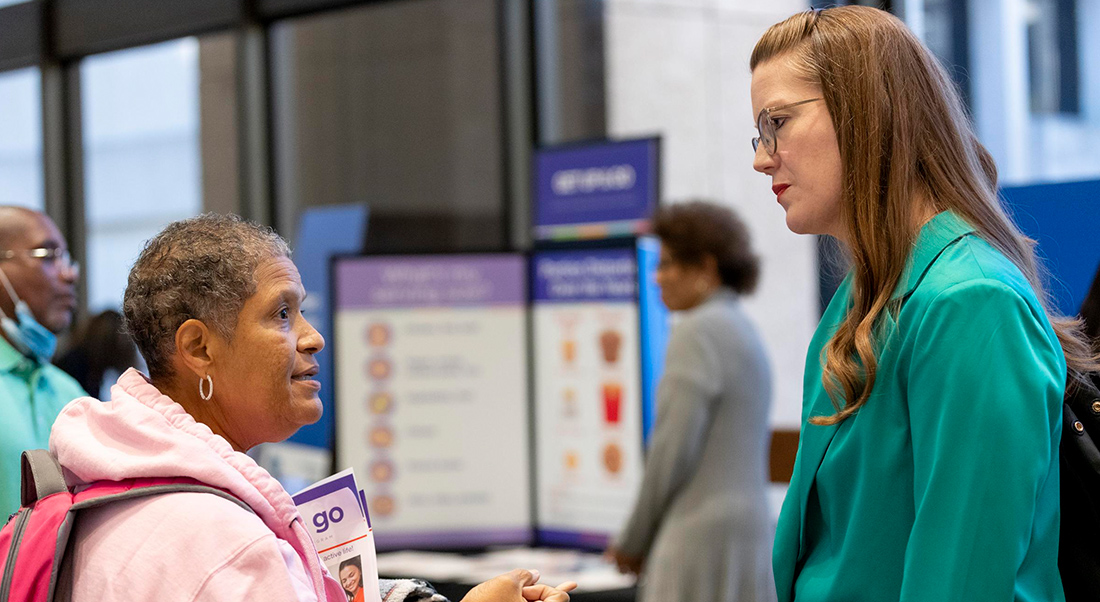 Weight Wellness day attendee speaking with Dr. Albin