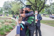 Dr. Edgar Martinez hugs a loved one.