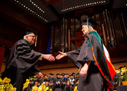 Dr. Bethany Werner accepts the Ho Din Award from Dr. Marvin J. Stone.