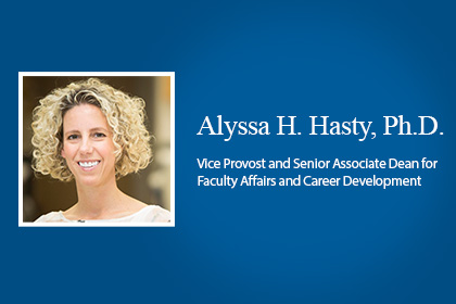 Smiling woman with curly blond hair in a blue banner with copy - Alyssa H. Hasty, Ph.D., Vice Provost and Senior Associate Dean for Faculty Affairs and Career Development