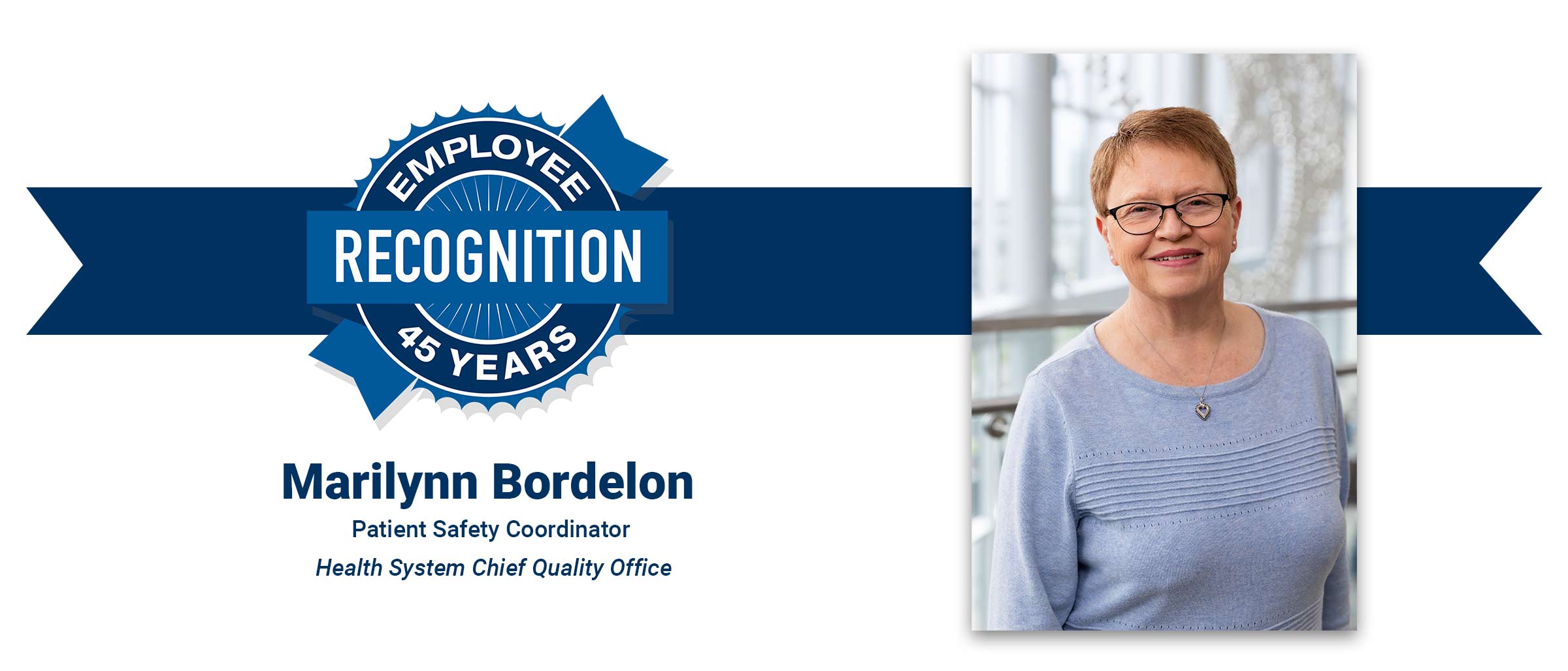 Woman with short red hair, light blue shirt. Marilynn Bordelon, 45 years employee recognition.