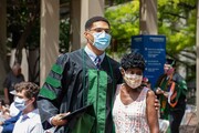 Dr. Terrul Ratcliff celebrates graduation with a loved one.