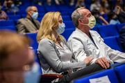 Dr. Novakovic-White watches the ceremony alongside her husband, Dr. Jonathan White.