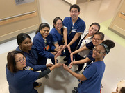 "My co-workers and I love the NICU. It is our favorite place because we get to holistically take care of babies and their families," said Ivaroni Pineda, who posed with his colleagues.
