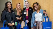 UTSW CRPs pose with treats and swag bags from the day’s celebration.