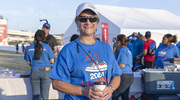 Holly Crawford, Executive Vice President for Business Affairs, refuels with some morning coffee before handing out more UTSW Heart Walk swag.