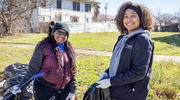 Volunteers are all smiles as they serve others.