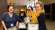 Gold pin recipients from Imaging Services strike a pose.