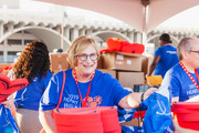 UTSW Vice President and Chief of Staff Dr. Robin M. Jacoby, in good spirits, handed out some UTSW-themed keepsakes to walkers.