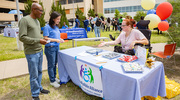 Sonnie Hoots of the EquallyAble Alliance BRG offers treats and goodies to attendees.