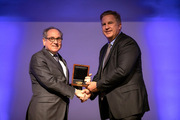 Dr. Robert Timmerman (right) receives the prestigious Patricia and William L Watson Jr., Award for Excellence in Clinical Care from Dr. Daniel K. Podolsky.