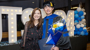 Molecular Biophysics graduate Liwei Wang, Ph.D., celebrates the event with a supporter by his side.
