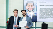 Clinical Research Coordinator Ahmed Gul, M.S., right, proudly poses with his Rising Star Award beside Eric Peterson, M.D., M.P.H., Vice Provost and Senior Associate Dean for Clinical Research.