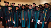 Graduates pose for a group photo. Front row, from left: Drs. Natalie Bonner, Neethu Augustine, Louise Atadja, Patrick Arraj, and Dhiraj Ankolekar; second row, from left: Drs. Seth Bohman, Evan Bogdan, Miles Black, Cylaina Bird, Coleman Beddingfield, Olatunde Badejo, and Rohit Badia.