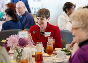 30-year service honoree Priscilla Alderman enjoys a conversation with other honorees.