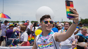 Parade: UTSW employee Evren Yurchak snaps a selfie as the parade is about to start.