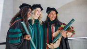 The proud moment is captured by family and friends of (from left) Drs. Cylaina Bird, Jordan Salley, and Nikita Agarwal.