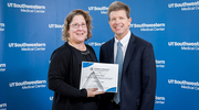 Patricia “Tricia” Plumb, RN, a Senior Research Nurse in the Peter O’Donnell Jr. Brain Institute, receives this year’s recognition for Excellence in Clinical Research – Associate Dean’s CRP of the Year from Dr. Peterson.