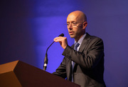 Dr. James Brugarolas accepts a Program Development Award on behalf of the Kidney Cancer Program, and asks everyone associated with the Program to stand for a round of applause.