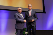 Dr. Podolsky presents Dr. Collins with the 2022 Patricia and William L. Watson Jr., M.D. Award for Excellence in Clinical Medicine.