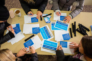 Students focus on writing thank-you notes to donors.