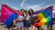 Parade: UTSW employee Laura Kirk (center) is surrounded by festive paradegoers, her daughter Cora Marie Kirk (right), and Cora’s friend Ximena Rondon.