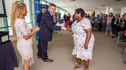 Michael Serber, M.B.A., Vice President of Finance and Institutional CFO, presents Latasha Stevenson with her Platinum PACT pin recognition.