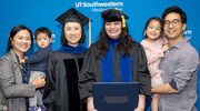 Amrita Gokhale, Ph.D., M.S., holding her degree, stands beside mentor, Elizabeth Chen, Ph.D., Professor of Molecular Biology and Cell Biology, along with Donghoon Lee, Ph.D., (far right), Instructor in the Lyda Hill Department of Bioinformatics, and Dr. Lee’s family.