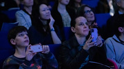 Attendees are captivated by the moving videos that played during the ceremony.