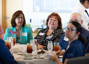 30-year honoree Tracy McGaw, left, beside Victoria England, watch as the program comes to a close.