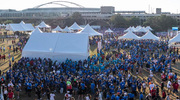 A crowd gathers near the tents in anticipation of the walk.