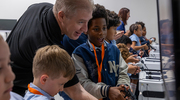 Bradley Mueller, B.A., a Clinical Simulations Operations Specialist in the UTSW Simulation Center, helps Biomedical Preparatory at UT Southwestern students get some hands-on experience during an October field trip. The school represents a unique partnership between UTSW and the Dallas Independent School District to expose students at young ages to science.