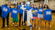 Students stop for a celebratory photo with Champ, the mascot of the Dallas Mavericks. From left: Dylan Beams, Roshni Thachil, Alex Gajewski, Marilyn Lu, Annie He, Kim Le, and Keerthana Chakka.
