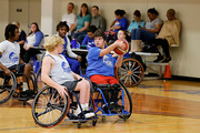 A basketball player gains control of the ball.