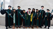 From left: UT Southwestern Medical School graduates Drs. Justin Yan, Reena Jasani, Anurag Gupta, Anjali Chacko, Matt Cline, Louise Atadja, Ami Kapadia, Steven Duncan, and Tianyi “Terry” Wu celebrate earning their degrees.