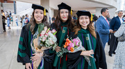 Picture perfect with their diplomas and bouquets are (from left) Kim Le, M.D., Chieh-An “Vivian” Chen, M.D., and Jorena Lim, M.D.