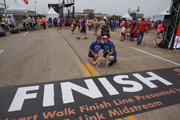 A canine Heart Walker poses with its humans at the finish line.
