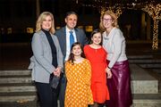 Dr. Becky Ennis celebrates with her family on McDermott Plaza.