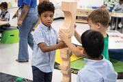 This group of boys gets serious about building a block tower.