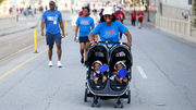 Twice the effort was all in fun for this baby-toting supporter.