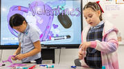 Annabel (left) and Estela are hard at work making their valentines for the patients at William P. Clements Jr. University Hospital (CUH).