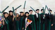 UT Southwestern Medical School graduates raise their diplomas to celebrate earning their degrees on May 8, 2024. Rejoicing at the Morton H. Meyerson Symphony Center (from left) are Brianna Alvarado, M.D., Chieh-An “Vivian” Chen, M.D., Maishara Muquith, M.D., Kim Le, M.D., Annie He, M.D., Aaron Hurd, M.D., Connor Eichenwald, M.D., Feroz James, M.D., and Armon Amini, M.D.