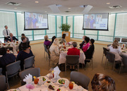 Honorees view a slideshow of their portraits.