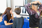 Dr. Alison Cabrera, UTSW Assistant Professor of Orthopaedic Surgery, used an X-ray demonstration to educate attendees about bone breaks and identifying bones correctly.