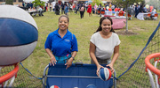 Dawn Cureton (left) and Brhea Washington (right) aim and score during a game of basketball.